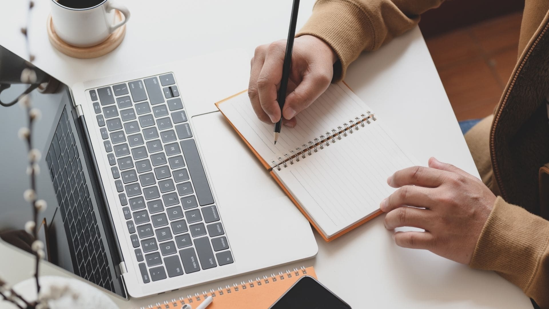 Copywriting and website design notebook on desk with computer